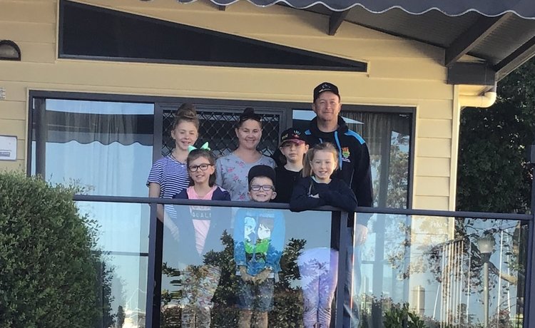 Family standing on balcony 